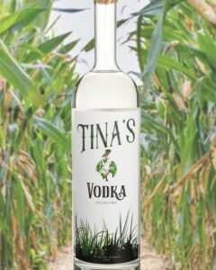 Tinas Vodka Bottle in a crop field